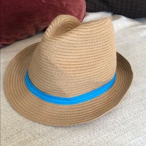 Tan fedora hat with blue trim